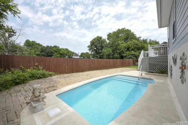 view of pool with a patio area and a deck