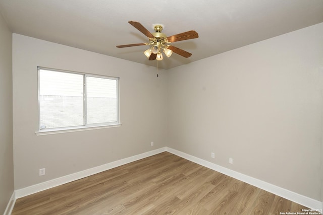 empty room with ceiling fan and light wood-type flooring