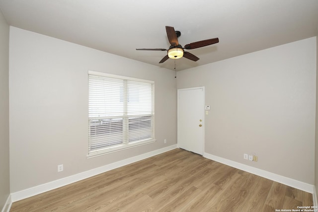 unfurnished room with ceiling fan and light hardwood / wood-style floors