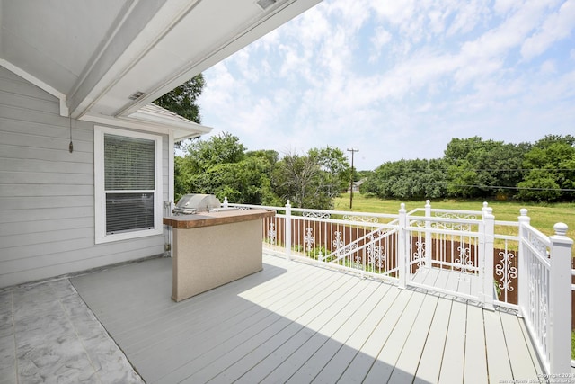 wooden terrace with area for grilling