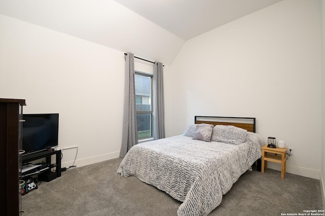 bedroom with carpet and lofted ceiling