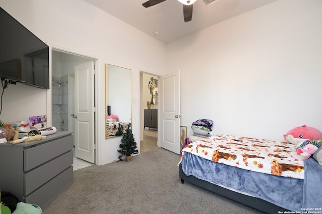 carpeted bedroom with ceiling fan and connected bathroom