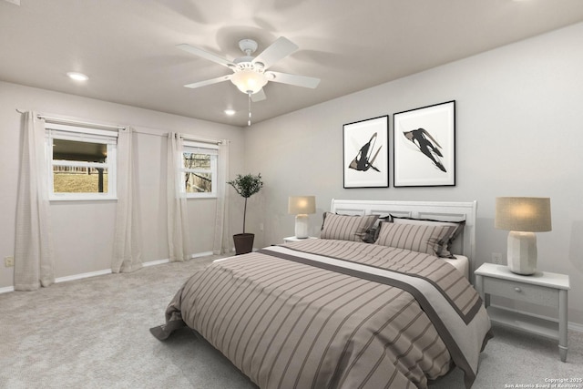 carpeted bedroom with ceiling fan