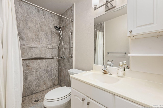 bathroom with toilet, a shower with curtain, and vanity