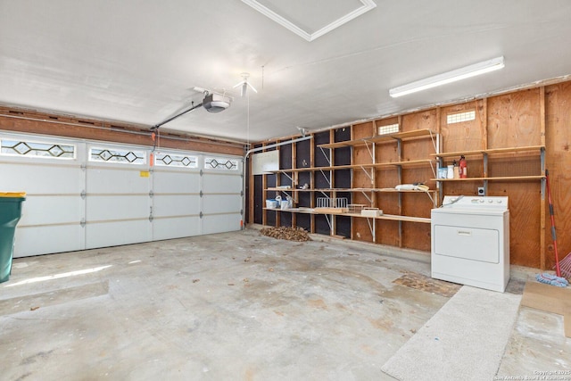 garage featuring washer / clothes dryer and a garage door opener