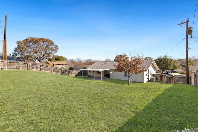 view of yard with central AC