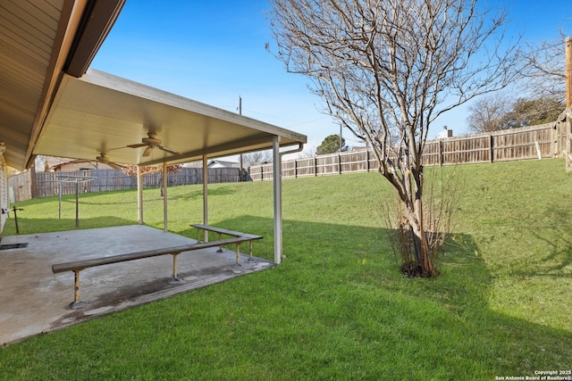 view of yard featuring a patio and ceiling fan