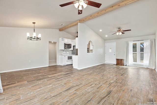 unfurnished living room with lofted ceiling with beams and ceiling fan with notable chandelier