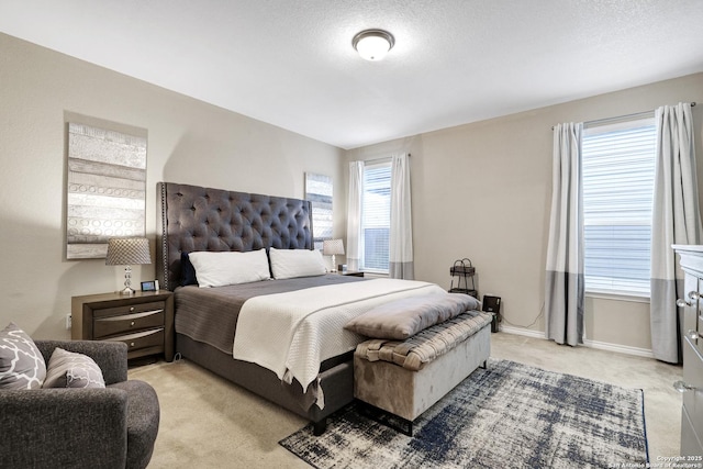 carpeted bedroom featuring a textured ceiling