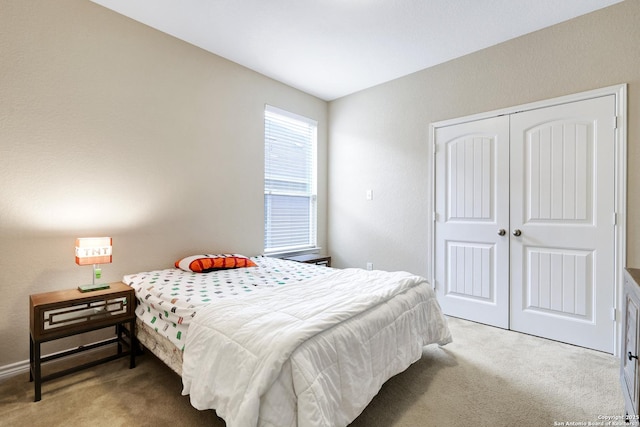 bedroom with a closet and carpet floors