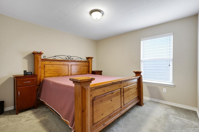 bedroom with light colored carpet and multiple windows