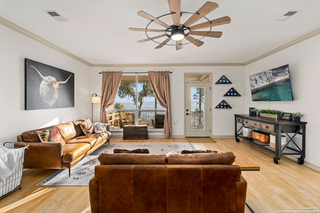 living room featuring ceiling fan, crown molding, and hardwood / wood-style flooring