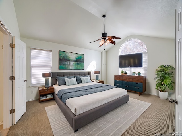 carpeted bedroom featuring ceiling fan and lofted ceiling