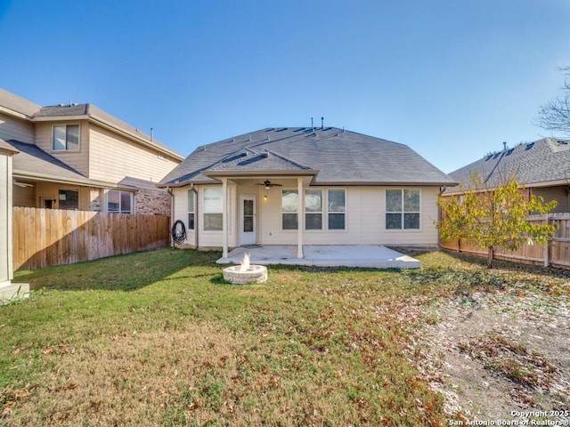 back of house with a yard, ceiling fan, and a patio area