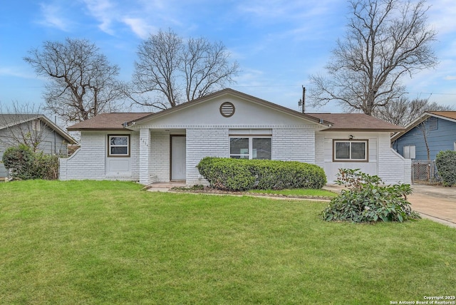 ranch-style home with a front lawn