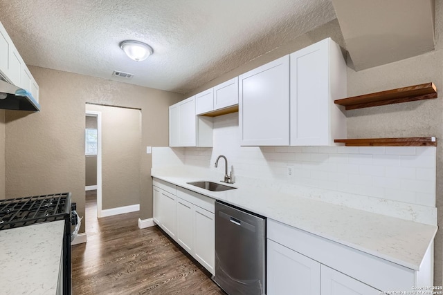 kitchen featuring light stone countertops, stainless steel appliances, white cabinetry, and sink