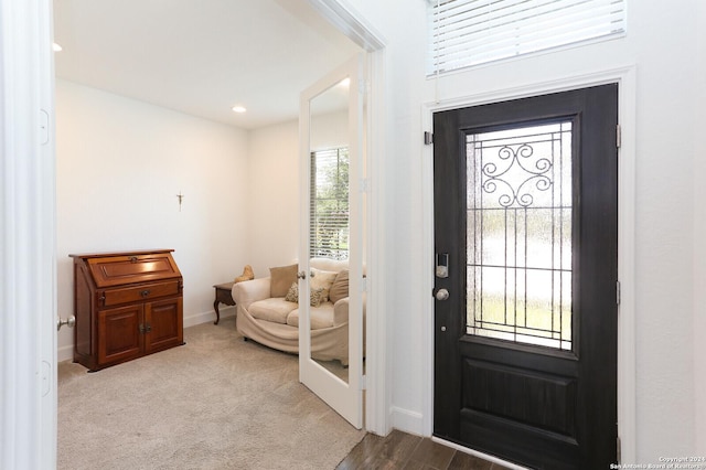 entrance foyer with light carpet