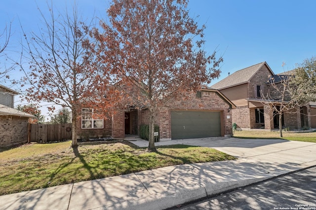 view of front of property featuring a garage and a front yard