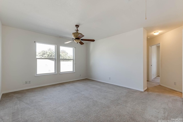 empty room with light carpet and ceiling fan