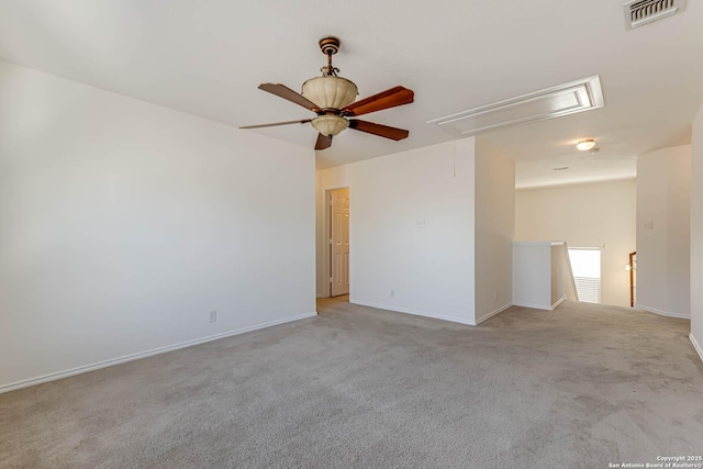 unfurnished room featuring light colored carpet and ceiling fan