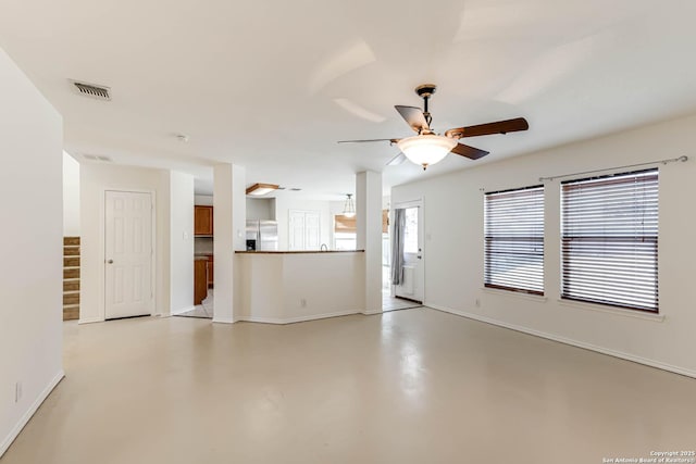 unfurnished living room with ceiling fan