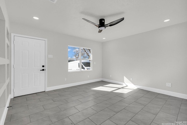 spare room featuring ceiling fan