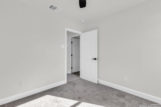 empty room featuring light colored carpet