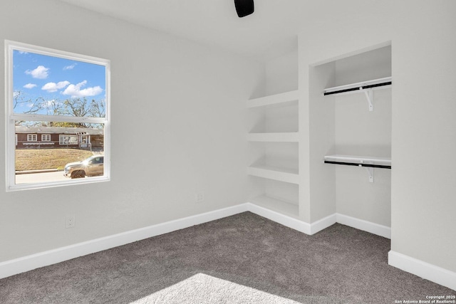 unfurnished bedroom with carpet flooring, ceiling fan, and a closet