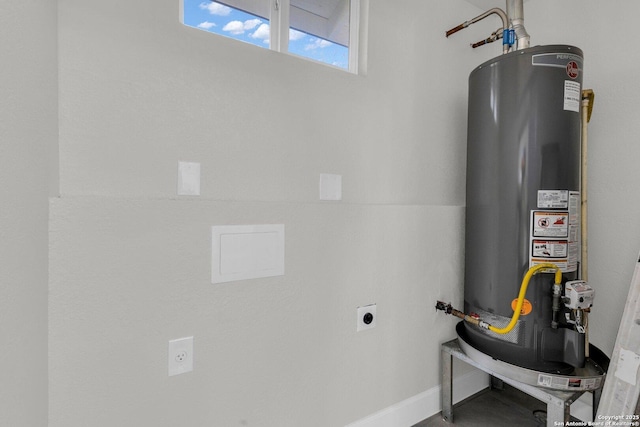 utility room with gas water heater