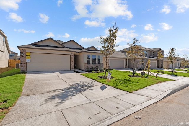 view of front facade with brick siding, an attached garage, concrete driveway, and a front lawn