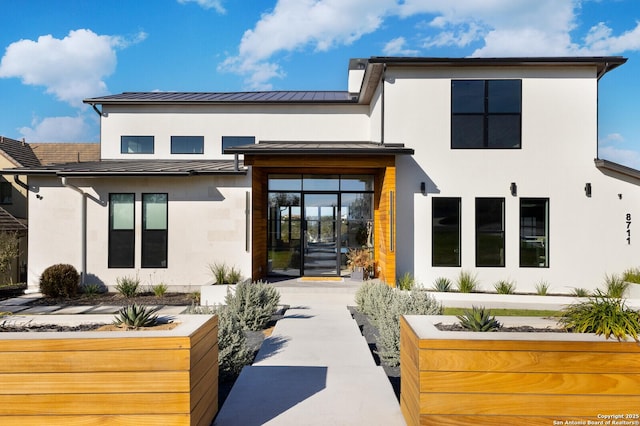 back of property with french doors