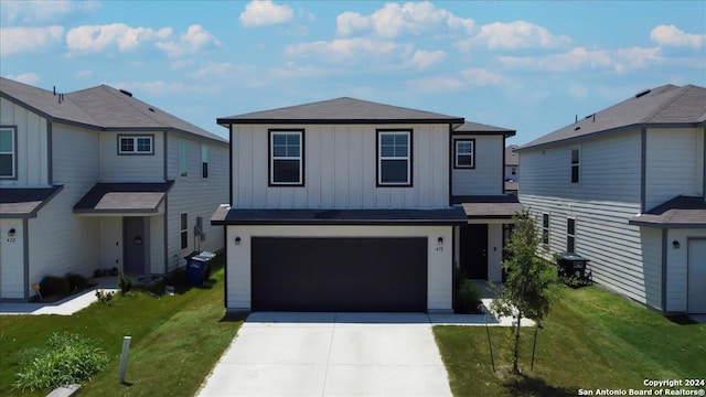 front of property featuring a garage and a front lawn