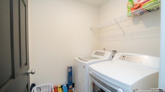 washroom with washer and dryer