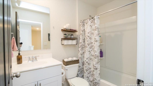 full bathroom with shower / bath combo with shower curtain, vanity, and toilet