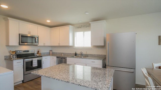 kitchen featuring sink, white cabinets, and appliances with stainless steel finishes