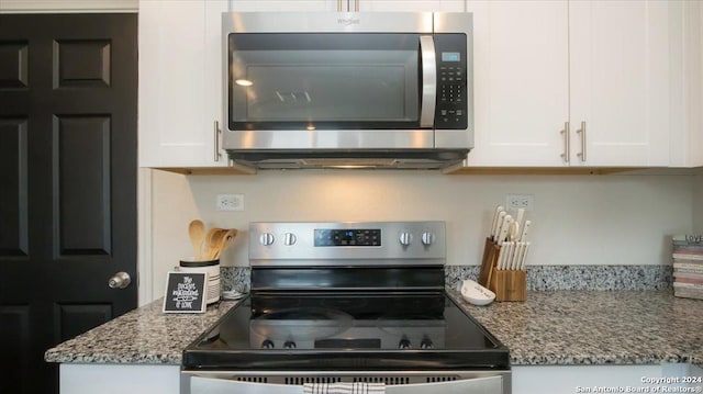 kitchen featuring white cabinets, stainless steel appliances, and stone counters