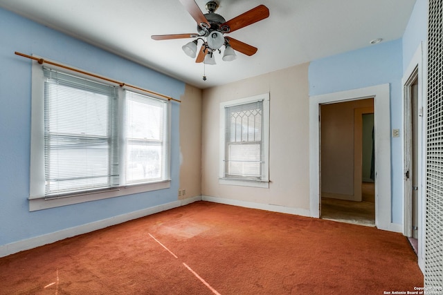 empty room featuring carpet and ceiling fan