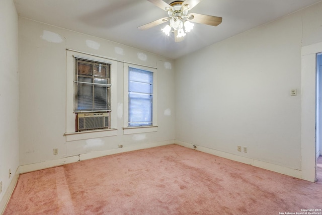 carpeted spare room with ceiling fan and cooling unit