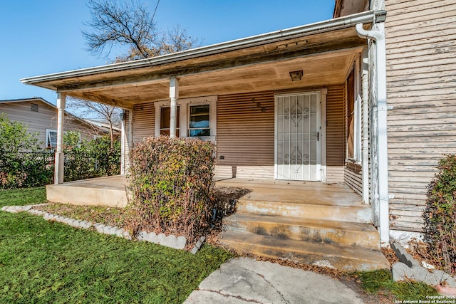 doorway to property featuring a porch