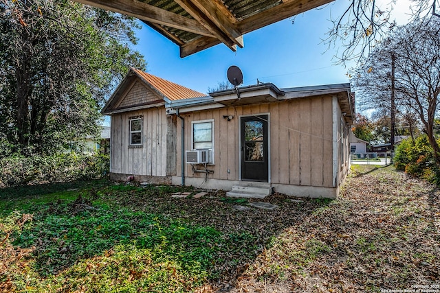 back of house with cooling unit