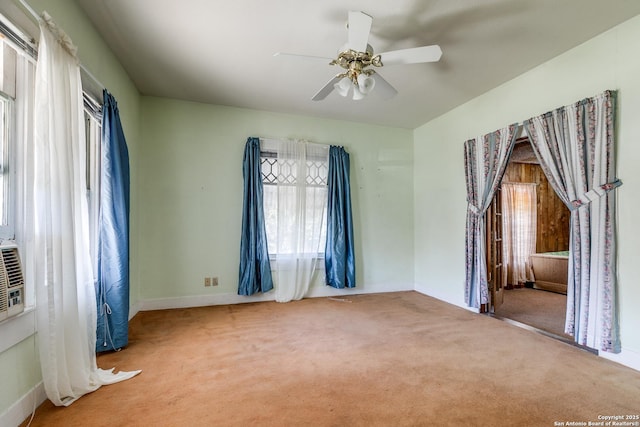 spare room with carpet and ceiling fan