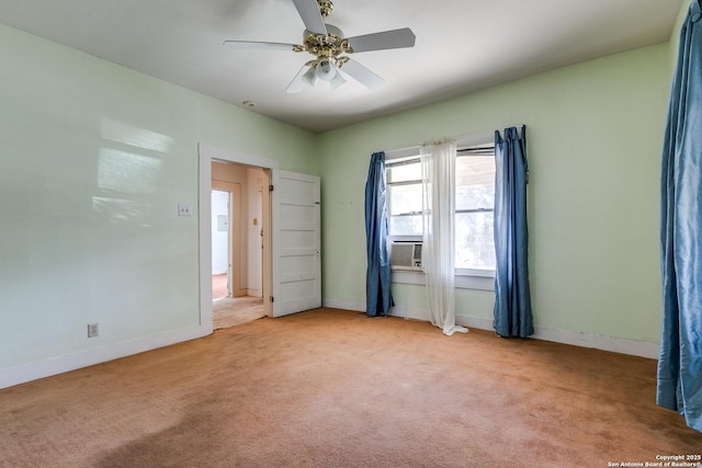 unfurnished room featuring ceiling fan and light carpet