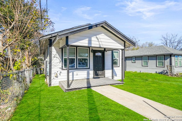 bungalow featuring a front yard