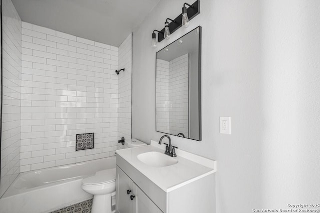 full bathroom featuring vanity, toilet, and tiled shower / bath combo