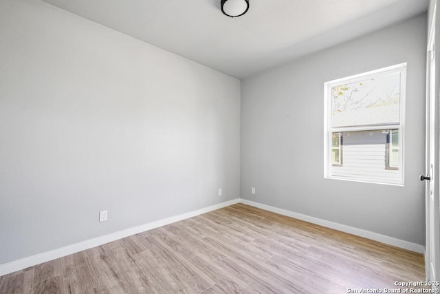 empty room with light hardwood / wood-style floors