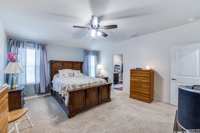 bedroom with ceiling fan, light colored carpet, lofted ceiling, and multiple windows