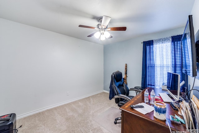 office with light carpet and ceiling fan