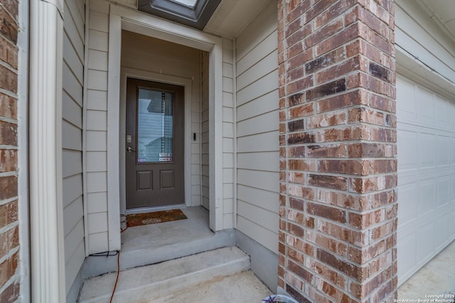 property entrance with a garage