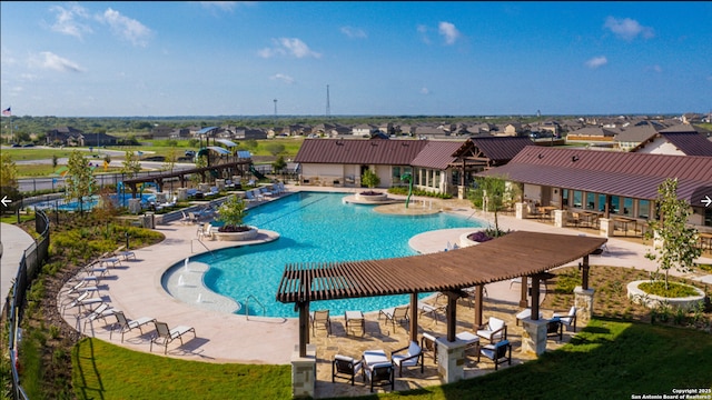 view of swimming pool featuring a patio area