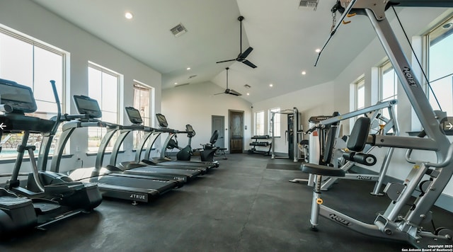 exercise room with ceiling fan and high vaulted ceiling